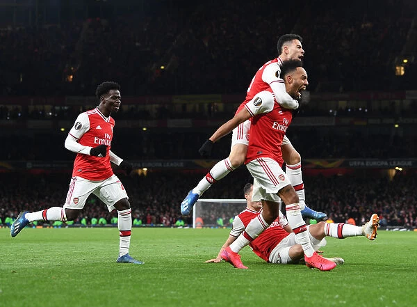 Arsenal's Aubameyang, Saka, and Martinelli Celebrate Goal Against Olympiacos in Europa League
