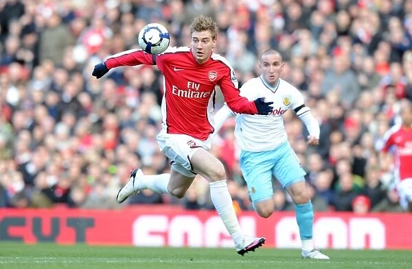 Arsenal's Bendtner Scores Against Burnley's Paterson in 3-1 Premier League Victory at Emirates Stadium, 2010