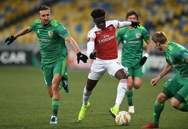 Arsenal's Bukayo Saka Faces Off Against Vyacheslav Sharpar in Europa League Clash