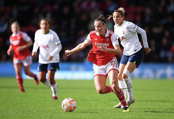 Arsenal's Caitlin Foord Fights Past Tottenham's Celin Bizet Ildhusoy in FA Women's Super League Clash