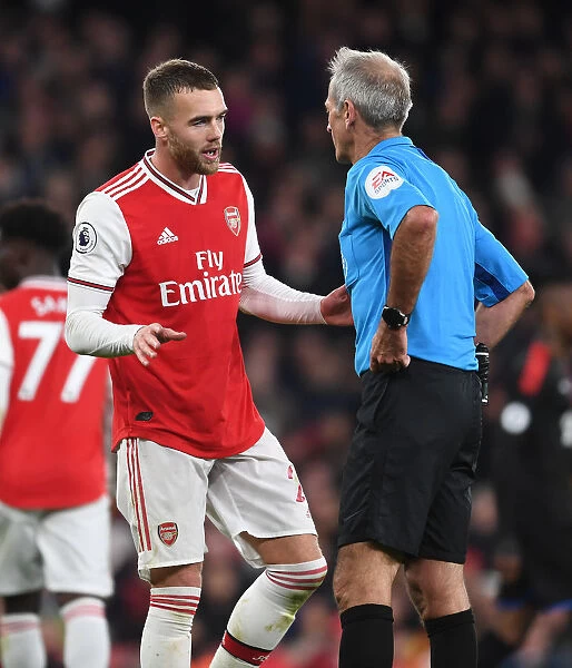 Arsenal's Calum Chambers Argues with Referee Martin Atkinson during Arsenal vs. Crystal Palace (2019-20)