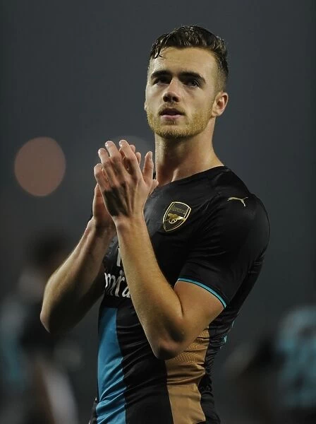 Arsenal's Calum Chambers Celebrates Capital One Cup Victory with Fans