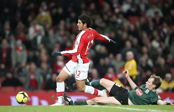 Arsenal's Carlos Vela Celebrates Against Plymouth's David Gray in FA Cup Third Round
