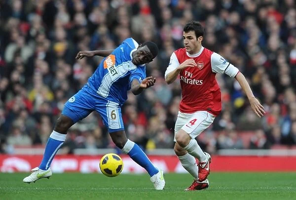 Arsenal's Cesc Fabregas Dominates Hendry Thomas in Arsenal's 3-0 Victory over Wigan Athletic