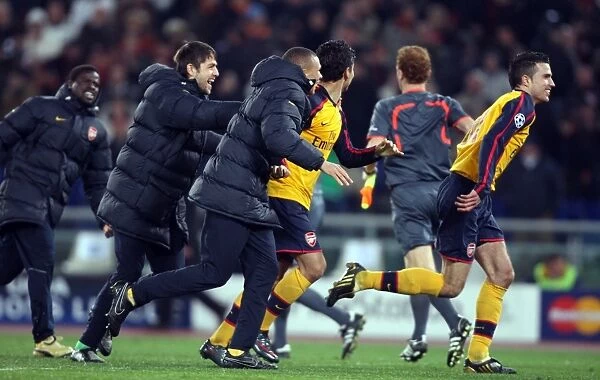 Arsenal's Champions League Victory: Robin van Persie and Team Celebrate Penalty Shootout Win Against AS Roma