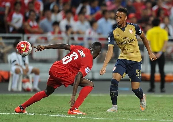 Arsenal's Chris Willock Goes Head-to-Head with Sirina Camara in Barclays Asia Trophy Clash