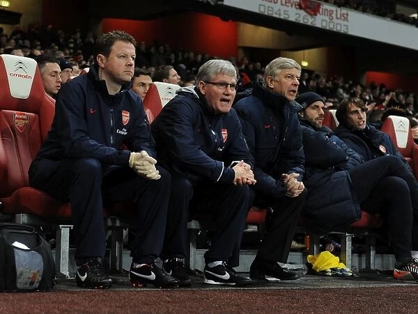 Arsenal's Coach Trio: Wenger, Rice, and Lewin (2011-2012) - Arsene Wenger, Pat Rice, and Colin Lewin during Arsenal vs. Wolverhampton Wanderers