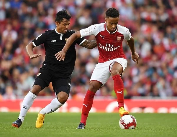 Arsenal's Cohen Bramall Clashes with Sevilla's Walter Montoya during the Emirates Cup Match