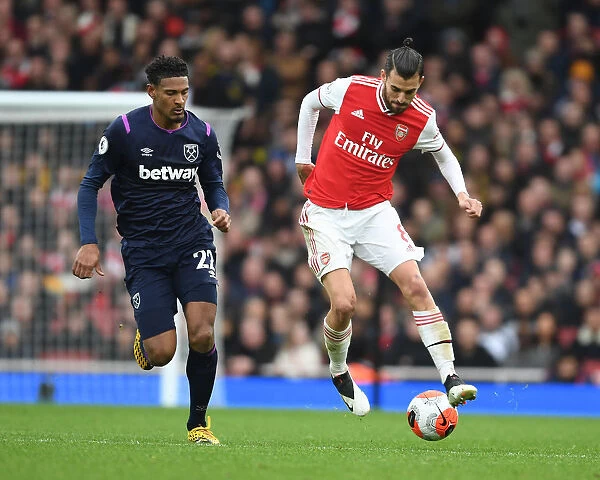 Arsenal's Dani Ceballos Outmaneuvers West Ham's Sebastien Haller in Premier League Clash