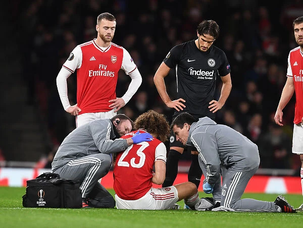 Arsenal's David Luiz Receives Medical Attention During Arsenal FC vs Eintracht Frankfurt UEFA Europa League Match