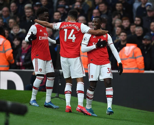 Arsenal's Eddie Nketiah, Bukayo Saka, and Pierre-Emerick Aubameyang Celebrate Goal vs Everton (Arsenal 1-0 Everton, 2019-20)