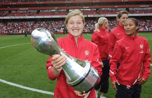 Arsenal's Ellen White Celebrates WSL Title with Trophy Amidst Arsenal's 1:0 Premier League Victory over Swansea City