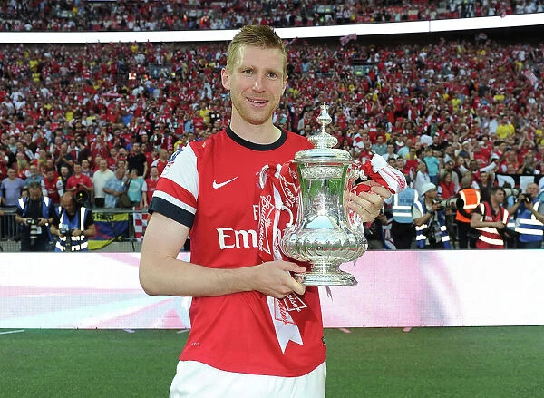 Arsenal's FA Cup Triumph: Per Mertesacker's Euphoric Celebration (2014)