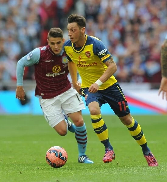 Arsenal's FA Cup Triumph: Mesut Ozil in Action against Aston Villa, 2015