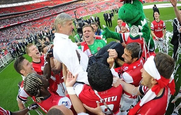 Arsenal's FA Cup Victory: Wenger Lifted in Triumphant Team Celebration