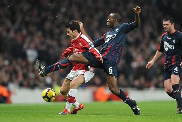 Arsenal's Fabregas and Muamba Clash in Exciting 4-2 Victory over Bolton