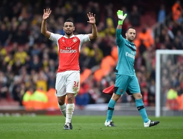 Arsenal's Francis Coquelin Celebrates with Fans after Securing Victory over Watford
