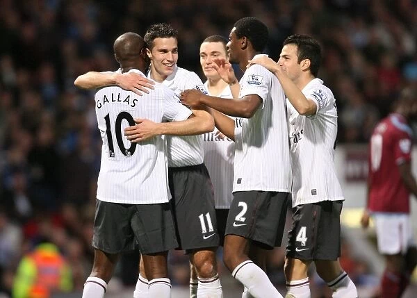 Arsenal's Gallas and Teams Celebrate Second Goal Against West Ham, 2009: A Triumphant Moment with Van Persie, Vermaelen, Song, and Fabregas