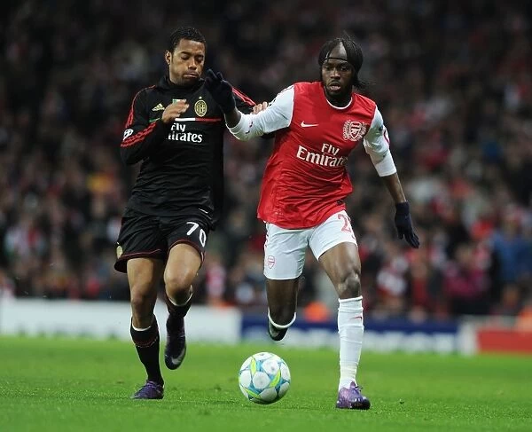 Arsenal's Gervinho Outmaneuvers AC Milan's Robinho in 2011-12 Champions League Clash