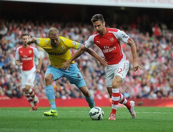 Arsenal's Giroud Clashes with Crystal Palace's Hangeland in Premier League Showdown