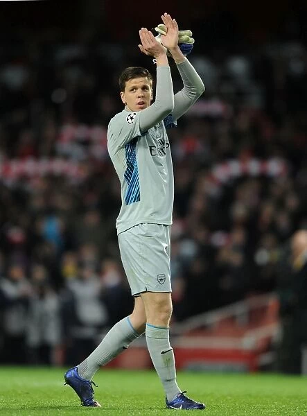 Arsenal's Glorious Victory: Wojciech Szczesny Celebrates with Fans after 3-0 Win over AC Milan in UEFA Champions League