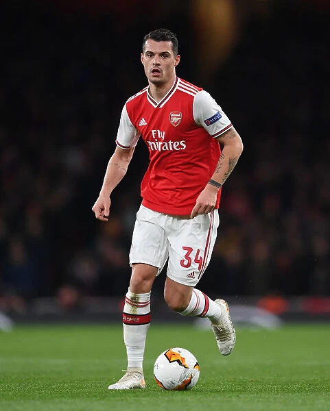 Arsenal's Granit Xhaka in Action against Olympiacos in UEFA Europa League Round of 32 (Arsenal vs Olympiacos, 2020)