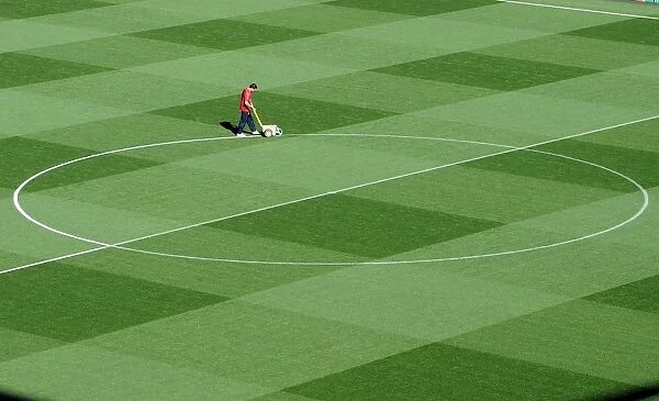 Arsenal's Groundsman Paul Ashcroft Prepares the Emirates Pitch for Arsenal's 2:1 UEFA Champions League Victory over Olympiacos (Group F)