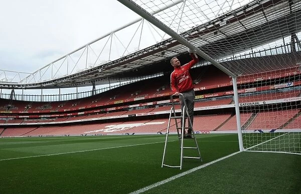 Arsenal's Groundsman Prepares Emirates Stadium for Arsenal v Sunderland Match
