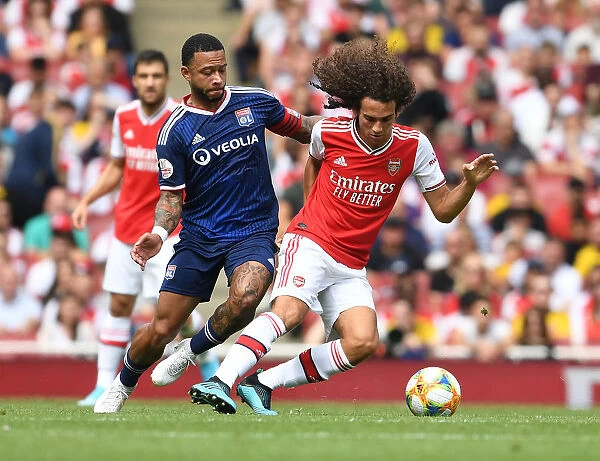 Arsenal's Guendouzi Outmaneuvers Depay in Emirates Cup Clash