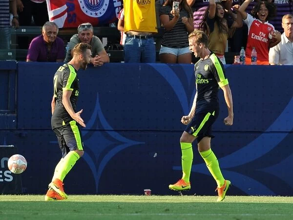 Arsenal's Holding and Chambers Celebrate Goal Against Chivas (2016-17)
