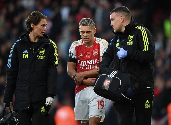 Arsenal's Injured Trossard Tended to by Medical Team During Arsenal v Burnley Match, 2023-24