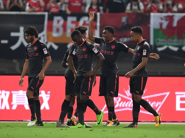 Arsenal's Iwobi, Nelson, and Bramall Celebrate Goal Against Bayern Munich in Shanghai Friendly, 2017