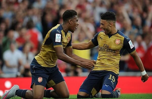 Arsenal's Iwobi and Oxlade-Chamberlain Celebrate Goals in Emirates Cup Victory over Olympique Lyonnais