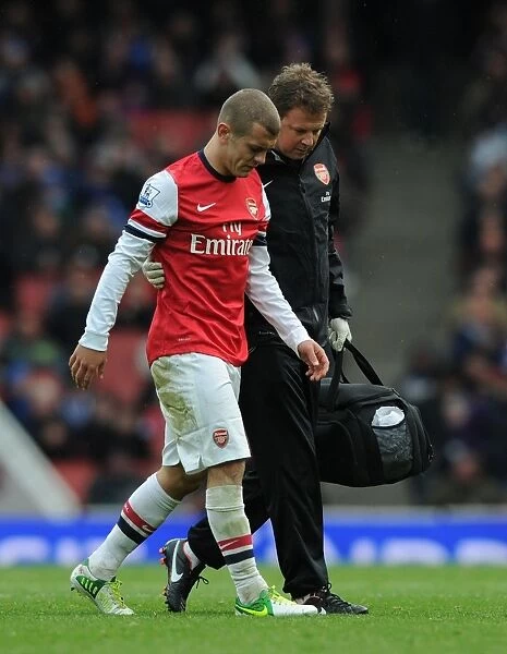 Arsenal's Jack Wilshere Receives Treatment from Physio Colin Lewin vs. Queens Park Rangers (2012-13)