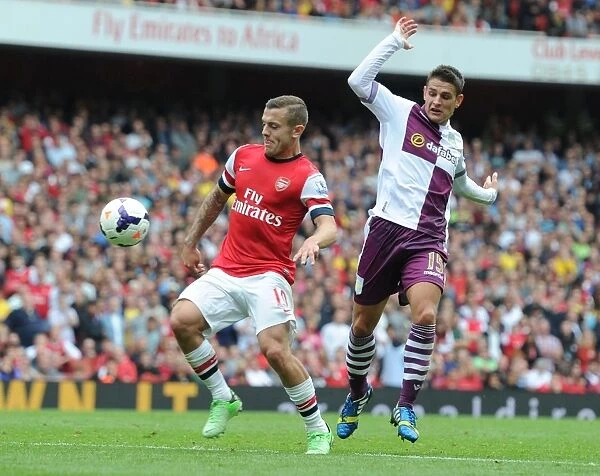Arsenal's Jack Wilshere Surges Past Aston Villa's Ashley Westwood in 2013-14 Premier League Clash