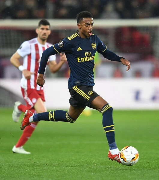 Arsenal's Joe Willock in Action against Olympiacos in UEFA Europa League Round of 32, Piraeus 2020