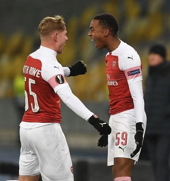 Arsenal's Joe Willock and Emile Smith Rowe: Celebrating Goals in Europa League Victory over Vorskla Poltava
