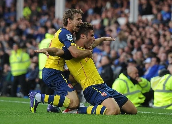Arsenal's Jubilant Moment: Giroud and Monreal Celebrate Victory over Everton, 2014 / 15 Premier League