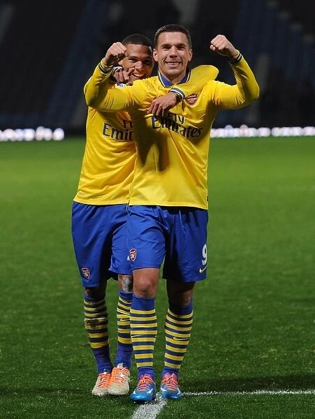 Arsenal's Jubilant Winning Moment: Podolski and Gibbs Celebrate against West Ham United