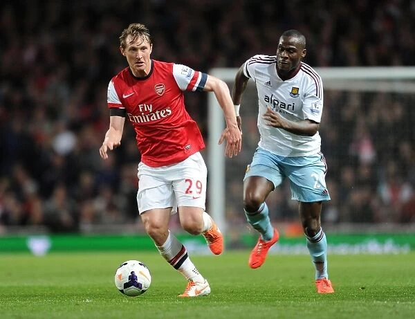 Arsenal's Kim Kallstrom Outwits Guy Demel: A Thrilling Moment from the Arsenal vs. West Ham Match