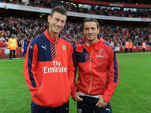 Arsenal's Koscielny and Debuchy Celebrate Emirates Cup Victory