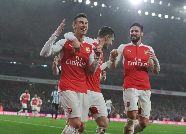 Arsenal's Koscielny, Ramsey, and Giroud: Celebrating a Goal Against Newcastle United (2015-16)