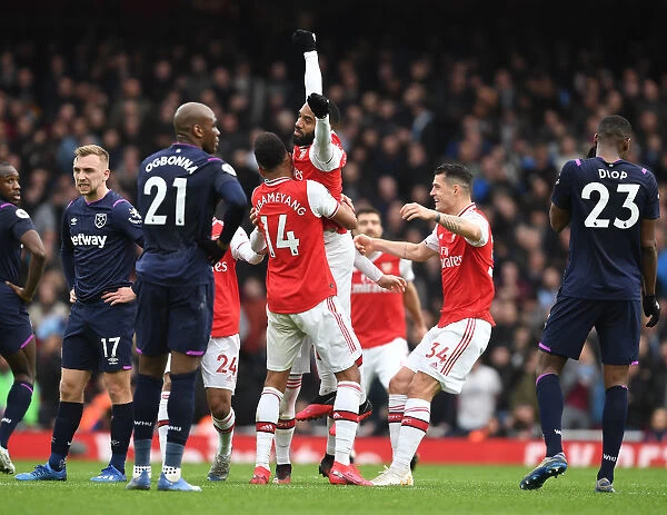 Arsenal's Lacazette, Aubameyang, and Xhaka Celebrate Goal Against West Ham United (2019-20)