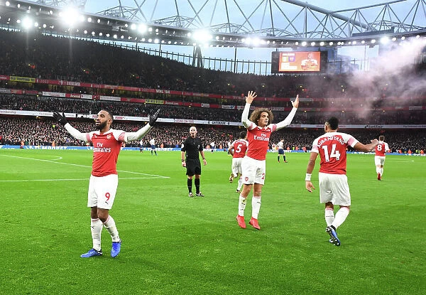 Arsenal's Lacazette, Guendouzi, and Aubameyang Celebrate Goals Against Tottenham in 2018-19 Premier League Match