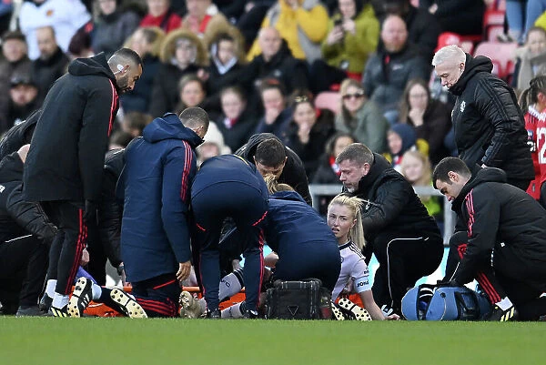 Arsenal's Leah Williamson Receives Medical Attention During Manchester United vs Arsenal Women's Super League Match