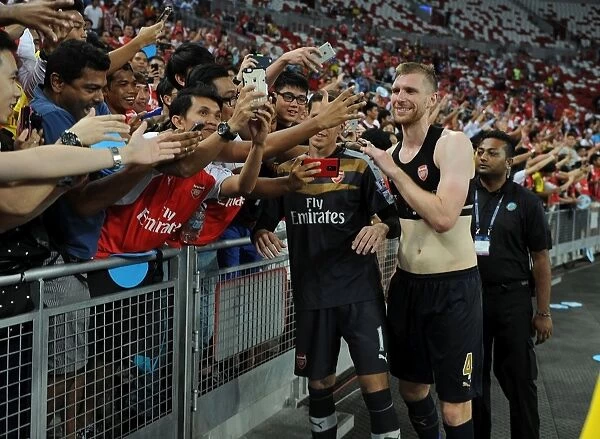 Arsenal's Per Mertesacker Celebrates Victory with Fans in Singapore, 2015