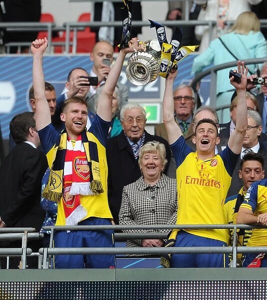 Arsenal's Per Mertesacker and Laurent Koscielny Celebrate FA Cup Victory over Aston Villa