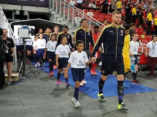 Arsenal's Per Mertesacker Leads Team Out in Arsenal v Singapore XI Match, Kallang, Singapore (July 15, 2015)