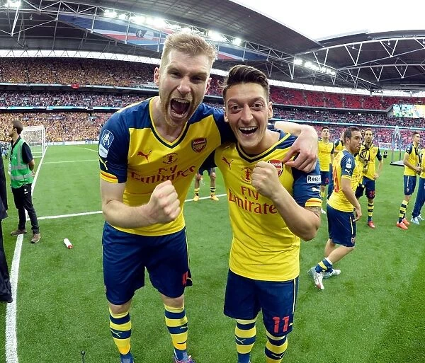 Arsenal's Mertesacker and Ozil Celebrate FA Cup Victory