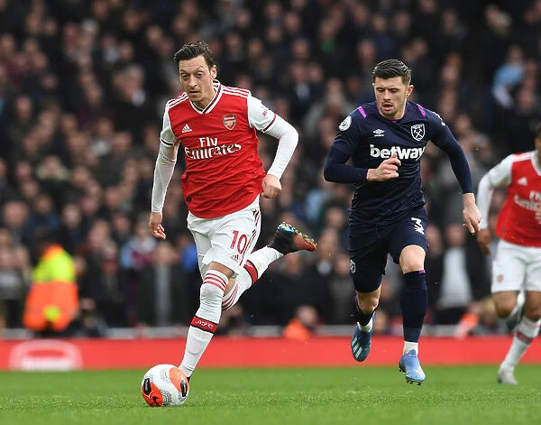 Arsenal's Mesut Ozil Clashes with West Ham's Aaron Cresswell in Premier League Showdown